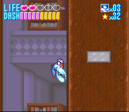 Buster corre pela parede usando a disparada — SNES