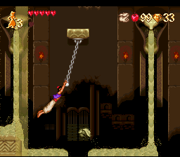 Aladdin se pendura num cenário da pirâmide — SNES